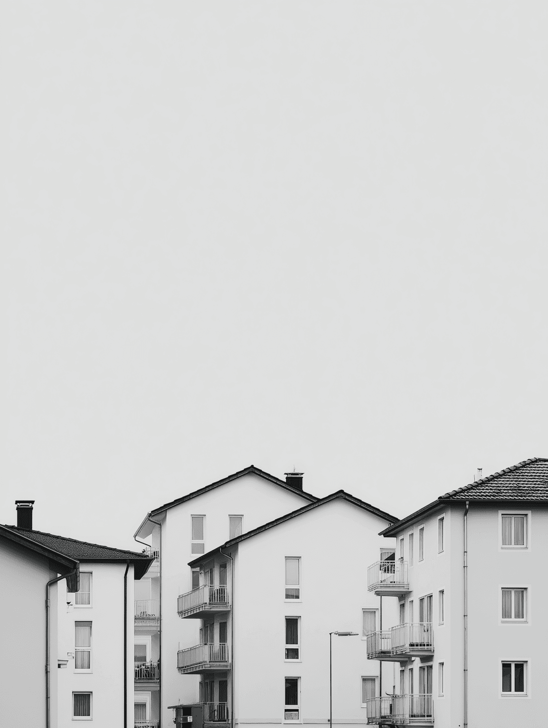 Modern residential apartment buildings under an overcast sky